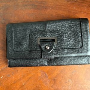 Beautiful new black leather Perlina wallet with snap closure